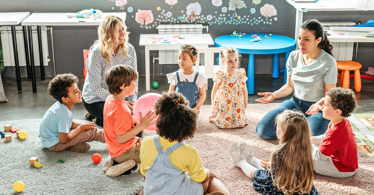 Teacher reading to preschoolers