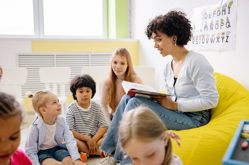 Teacher reading to preschoolers