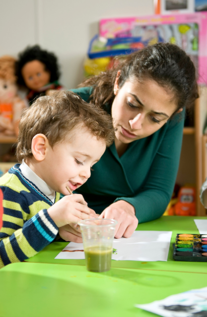 Teacher reading to preschoolers
